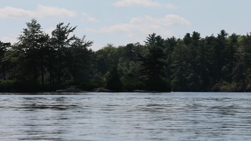 water flowing in lake awosting minnewaska state park hudson valley upstate new york hiking adventure destination shawangunk mountains gunks catskills beautiful pond pitch pine trees clouds moving