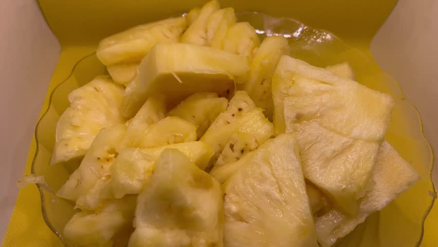 Healthy Pineapple Slices Displayed on Yellow Background