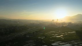 Aerial Sunrise Shot of the Cileunyi Interchange, Bandung, Showing Complex Highway Overpasses and Urban Fog Under Golden Light - Powered by Shutterstock - Get 15% off with code: PIKWIZARD15