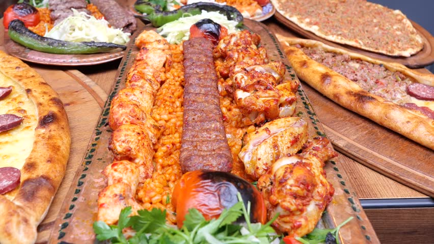 Delicious grilled meat feast with side dishes in Turkish restaurant