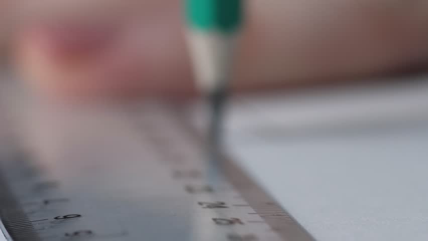 Extreme Close-up Pencil Drawing Straight Line with Ruler on Blueprint, Shallow Depth of Field