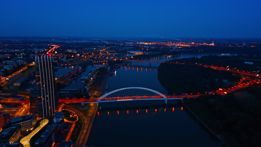 Beautiful illumination along the roads and bridges in Bratislava, Slovakia. Aerial view on the city at night.
