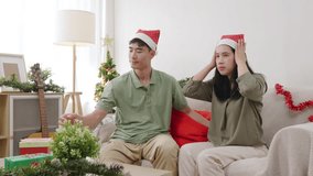 Happy christmas family people enjoying presents on cozy couch at home, xmas tree decor creates festive atmosphere, couple sharing gifts and warm laughter. - Powered by Shutterstock - Get 15% off with code: PIKWIZARD15