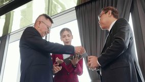 Group asian business team with businessman signing digital contract on tablet with agreement success while handshake, e-signature and deal, business meeting with partnership with digital signature. - Powered by Shutterstock - Get 15% off with code: PIKWIZARD15