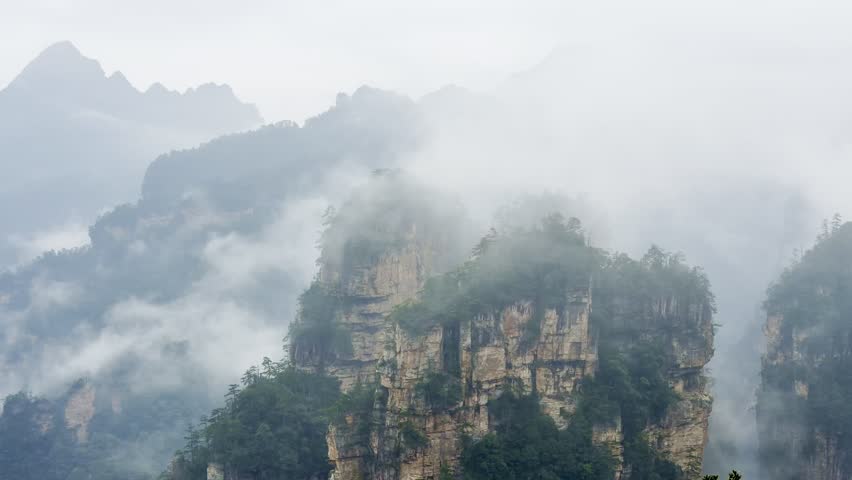 The mountains of Zhangjiajie National Park in Hunan Province, shrouded in mist, China