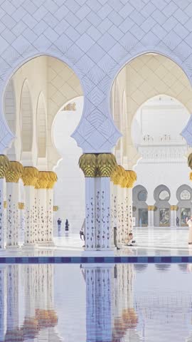 Sheikh Zayed Grand Mosque in Abu Dhabi, United Arab Emirates. 4K vertical video footage of one of largest mosques in the world. White marble domes and columns