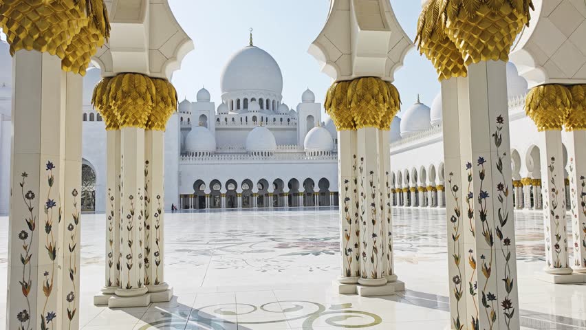 Sheikh Zayed Grand Mosque in Abu Dhabi, United Arab Emirates. 4K video footage of one of largest mosques in the world. White marble domes and columns