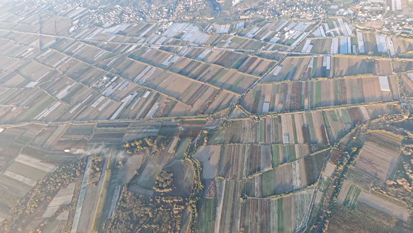 Aerial view of Albania scenic mountains, valleys, and untouched nature. Rugged terrain with lush greenery and dramatic elevation under clear skies
