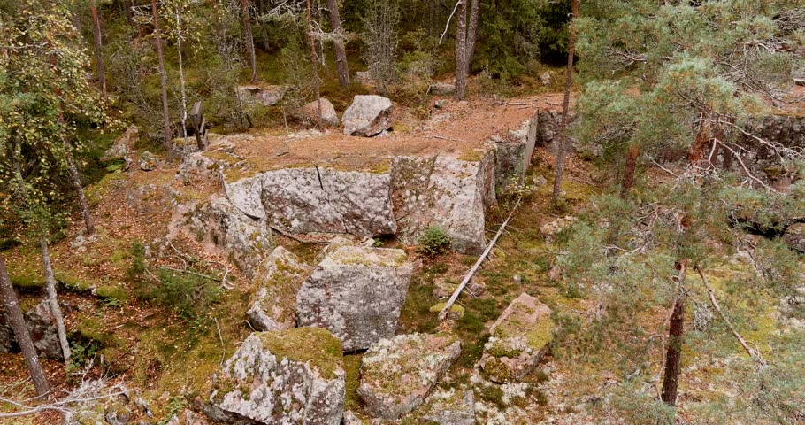 Aerial view of historical Pyterlahti red granite quarry in Hevonniemi in autumn, Virolahti, Finland.