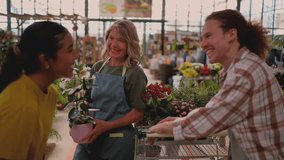 Knowledgeable female horticulturist at a nursery assisting a young couple in selecting a fragrant jasmine plant. Sharing her expertise and passion for gardening in a friendly and professional manner - Powered by Shutterstock - Get 15% off with code: PIKWIZARD15