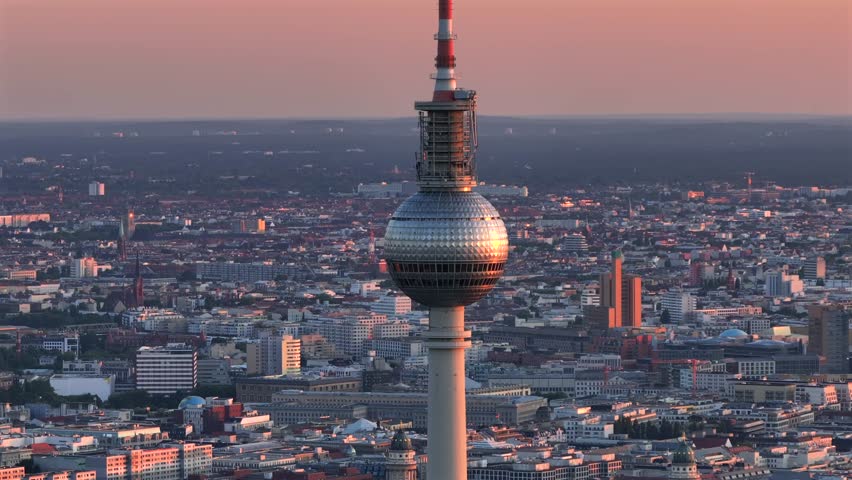 Berlin TV Tower Close up Aerial View with Amazing Soft Sunset Light. Alexanderplatz Fernsehturm in Berlin City Center.