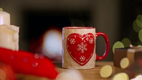 Man, male hand holding christmas decorated mug with steaming tea in cosy room. Winter time. - Powered by Shutterstock - Get 15% off with code: PIKWIZARD15