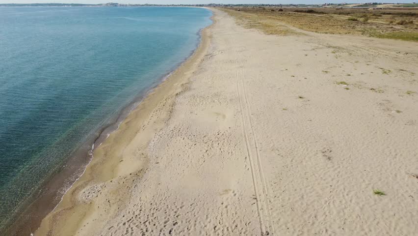 Aerial Drone Flight Along Long Wild Sandy Beach in Greece