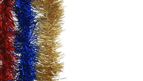 Colorful Christmas tinsel in red, blue, gold, and silver shimmering against a clean white background. Festive holiday garlands gently moving, creating a bright and decorative seasonal atmosphere. Perf - Powered by Shutterstock - Get 15% off with code: PIKWIZARD15