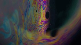 Vertical video. Psychedelic blur bubble. Oil pigment. Half round lens on black background. Abstract floating gasoline ink blend multicolor art fluid. - Powered by Shutterstock - Get 15% off with code: PIKWIZARD15