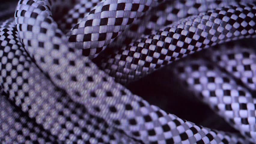 Multicolored climbing ropes. Mountaineering, static ropes, cord, paracord, sports, recreation, mountain equipment. Rotation. Yellow, green, white, climbing, personal protective equipment 