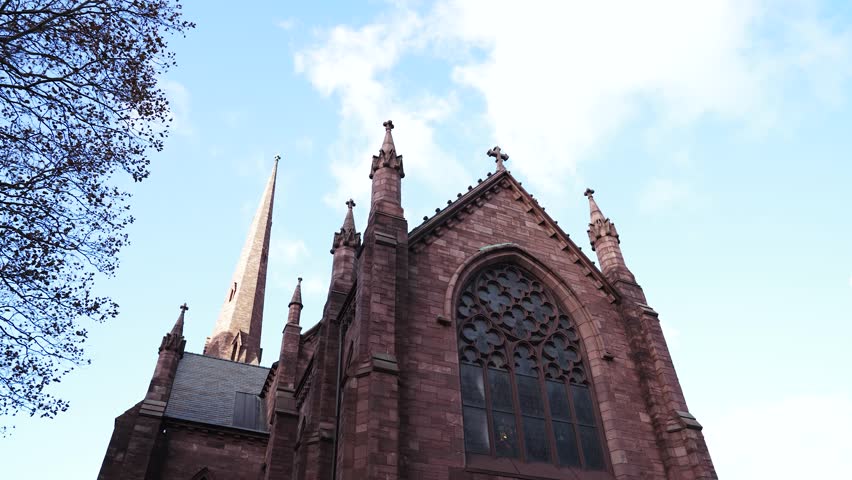Time-lapse video of St. Paul's Episcopal Cathedral church in Western Buffalo, New York on a beautiful clear blue sky day with clouds.