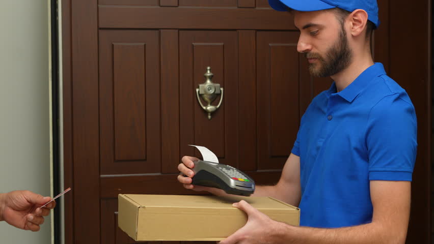delivery man carrying boxes to customer