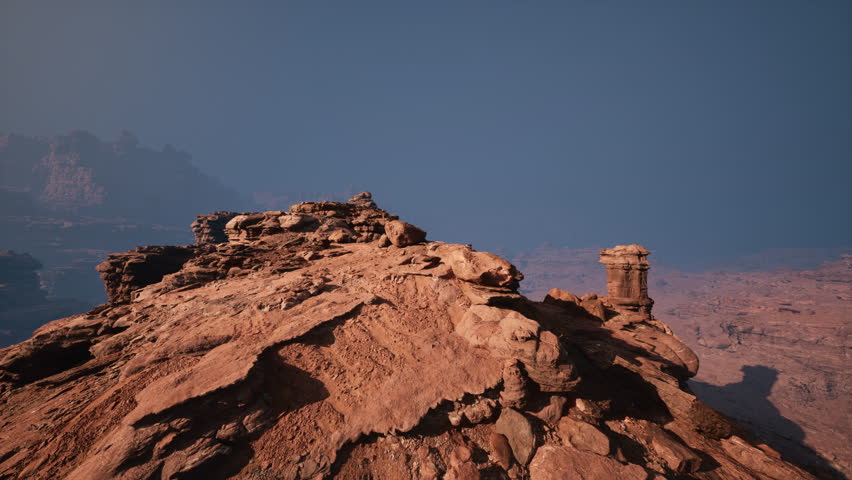 Witness the mesmerizing allure of a grand rocky outcropping, standing resolute amidst a barren desert.