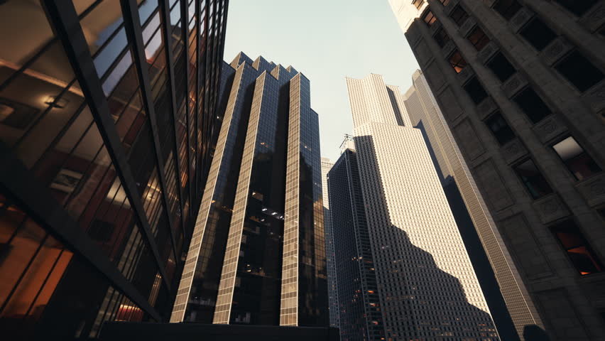 A view from below, looking up at the towering skyscrapers of New York City.