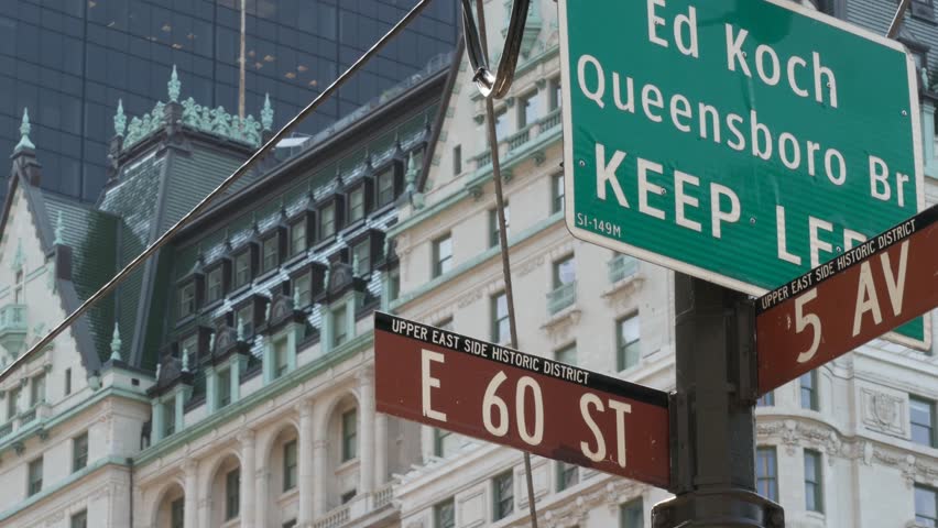 New York City Manhattan Midtown, United States. Old historic hotel building 1907 on Grand Army Plaza, 5 fifth avenue sign near Central Park. Classic iconic american architecture. Pulitzer Plaza in NYC