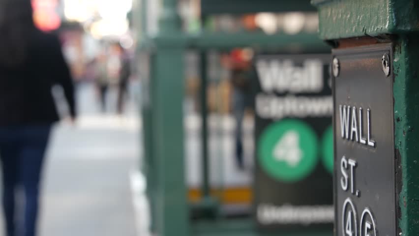New York City Broadway subway, metro entrance sign, Wall Street, United States. American underground, Manhattan Downtown transport. Metropolitan station in Financial District. People pedestrian, FiDi.