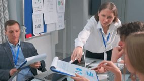 team examining data charts collaboratively, group of analysts reviewing and discussing data visualizations together, team of analysts from caucasian backgrounds collaborating on data analysis - Powered by Shutterstock - Get 15% off with code: PIKWIZARD15