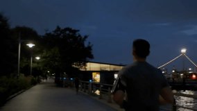 Athletic young man running on a pier, rear view, capturing fitness, outdoor exercise, and active lifestyle by the water. - Powered by Shutterstock - Get 15% off with code: PIKWIZARD15