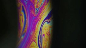 Spectrum ink fluid. Rainbow arch. Colorful round lens paint chaotic mix on black background. Purple blue orange blur abstract curl flow. - Powered by Shutterstock - Get 15% off with code: PIKWIZARD15