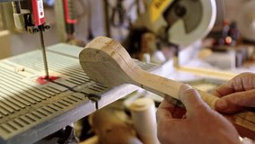 Carpenter shapes wooden spoons with essential tools in a workshop - Powered by Shutterstock - Get 15% off with code: PIKWIZARD15