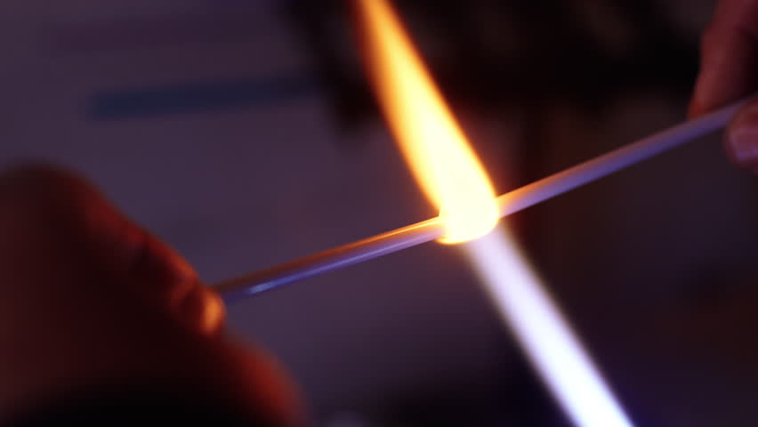 Melting metal with smelting flux flame techniques in a workshop