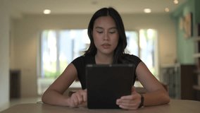 Portrait of young beautiful Asian Thai woman in library using digital tablet computer thinking - Powered by Shutterstock - Get 15% off with code: PIKWIZARD15