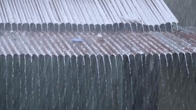 Heavy Rain Falling on a Corrugated Metal Roof During a Storm. - Powered by Shutterstock - Get 15% off with code: PIKWIZARD15