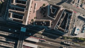 Vertical drone descent revealing Bahnstadt courtyards and railway tracks in bright sunlight. - Powered by Shutterstock - Get 15% off with code: PIKWIZARD15