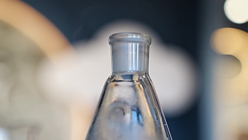 Clear glass bottle on display in modern cafe setting
