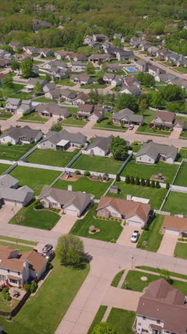 Suburban area with half houses colored red and blue, indicating political party support during us presidential elections in a too close to call night