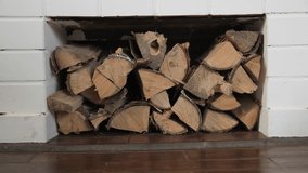 Chopped birch firewood in brick niche under fireplace - Powered by Shutterstock - Get 15% off with code: PIKWIZARD15
