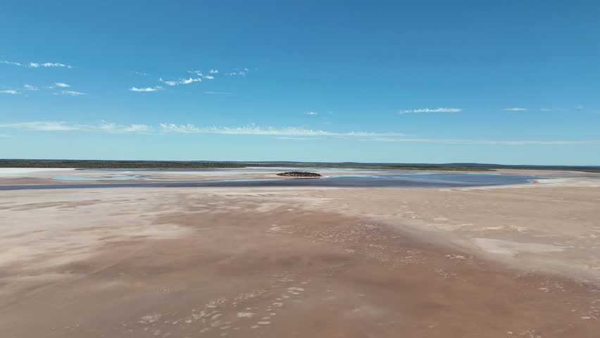 Aerial Lake Amadeus salty mud basin is the largest salt lake in Northern Territory Australia, about 50 km north of Uluru or Ayers Rock, stretching 180 kilometers long and 10 kilometers wide, salt lake