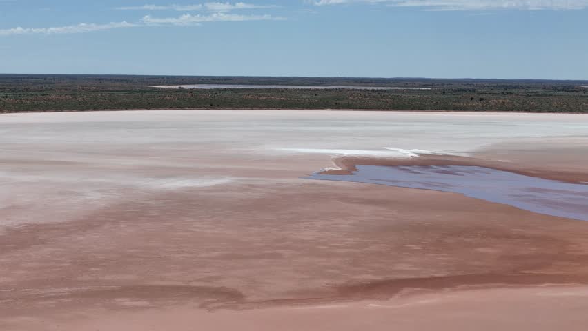 Aerial Lake Amadeus salty mud basin is the largest salt lake in Northern Territory Australia, about 50 km north of Uluru or Ayers Rock, stretching 180 kilometers long and 10 kilometers wide, salt lake