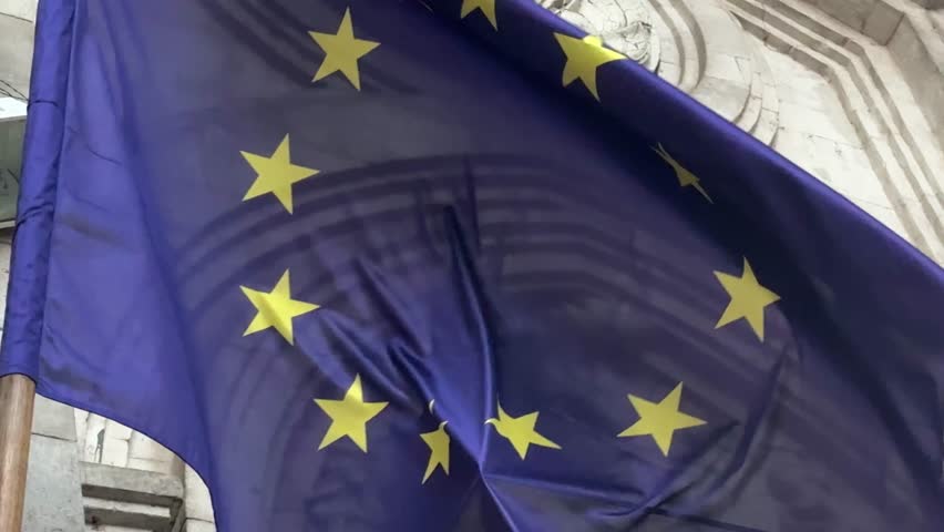 European Union flag close up view of the European Union flag waving in the wind. Selective focus. Realistic 3D seamless animation. 