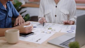 Close-up of Business Team Analyzing Financial Charts and Data on Desk - Powered by Shutterstock - Get 15% off with code: PIKWIZARD15