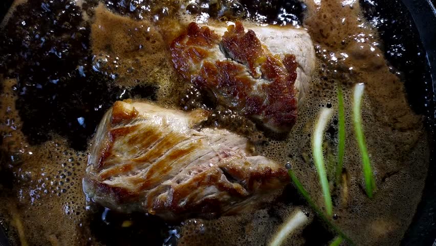 Boiling chopped pork in pot, indoor Chiangmai Thailand.