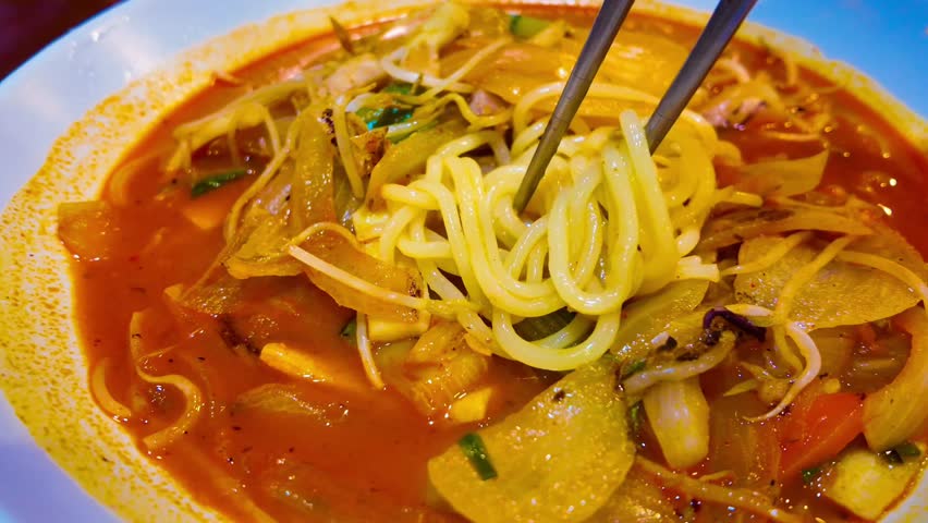 Jjamppong is a Korean noodle soup with red, spicy seafood