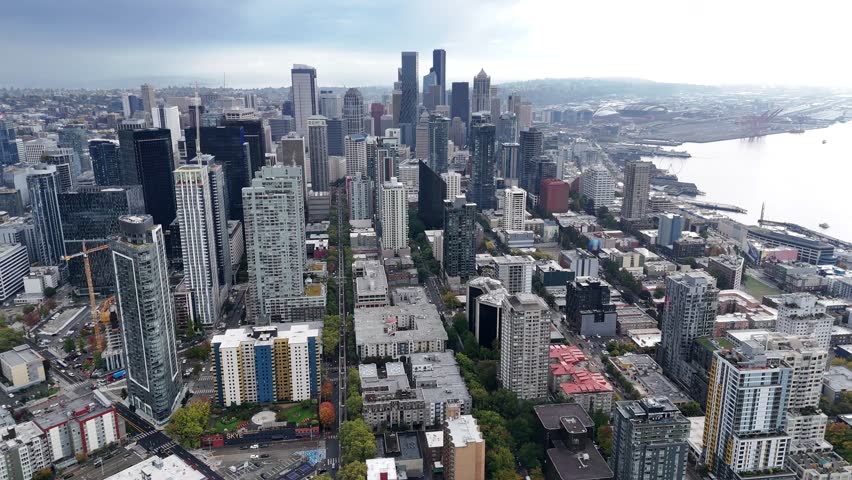 cinematic aerial Seattle downtown skyline, modern city architecture building Washington State largest city on the pacific ocean