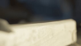 High quality video of a craftsman carving smooth curls from light wood in warm cinematic light, showing precise hand control and clean fine texture in a calm workshop atmosphere. - Powered by Shutterstock - Get 15% off with code: PIKWIZARD15