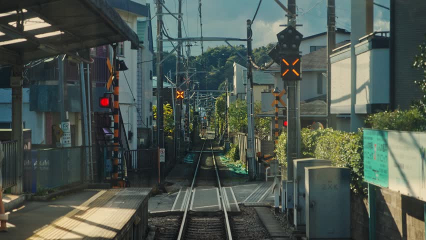 Train leaving a japanese railway station pov