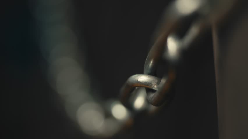 Selective Focus on Metal Chain Link with Dark Background