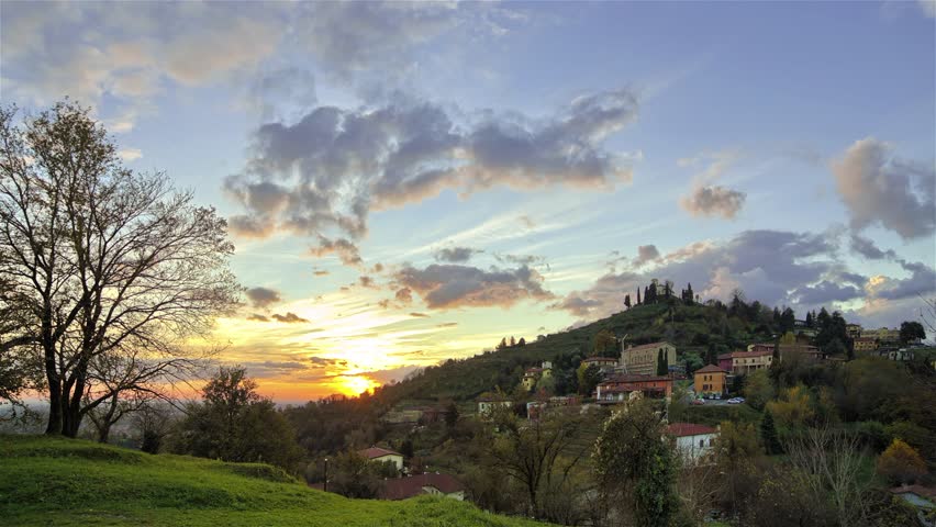 Colorful Sunset over Hillside Town Timelapse