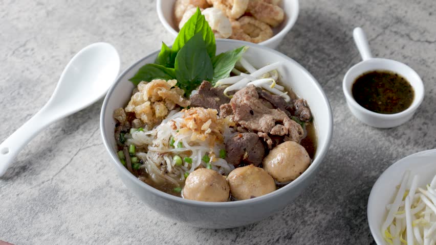 Boat noodles on a wooden table