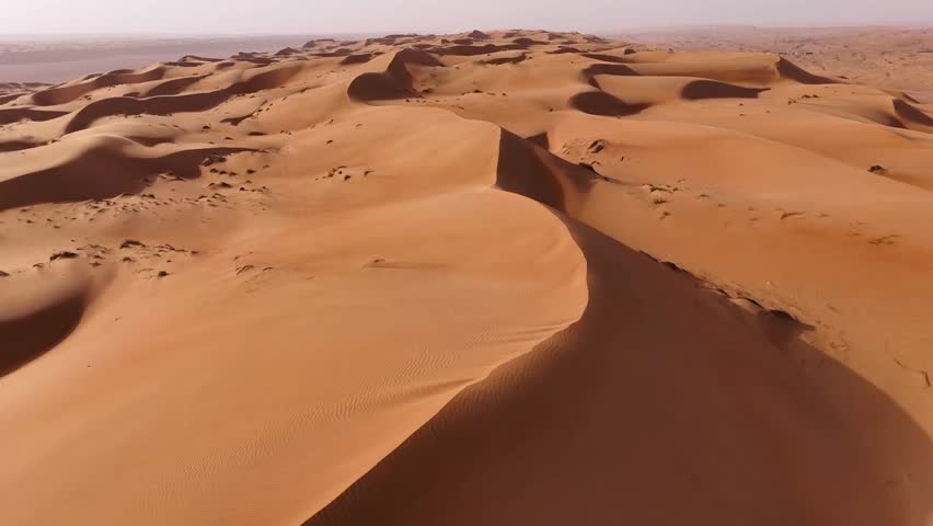 Desert with large sand dunes in Oman, Wahiba (Sharqiya) Sands is a large desert in the east of Oman